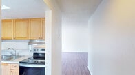 This 1050 square foot apartment in Summit West on 30A offers a well-designed living space with three bedrooms and two bathrooms. The single-story layout maximizes functionality, with the primary bedroom boasting a generous 170 square feet. The modern kitchen is a standout feature, showcasing light wood cabinetry, stainless steel appliances, and ample counter space. Stylish wood-look flooring runs throughout the apartment, creating a cohesive and warm atmosphere. The bathrooms are equipped with essential fixtures and continue the wood-toned aesthetic. An in-unit laundry room adds convenience with full-sized washer and dryer. Large windows in the bedrooms and living areas flood the space with natural light, while also offering views of the surroundings. The apartment's neutral color palette and clean lines provide a blank canvas for personal decoration. With its practical layout and modern amenities, this apartment offers comfortable living in a desirable location.