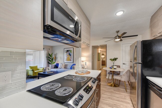 Kitchen with Electric Stove and Microwave - Canyon Terrace Apartments