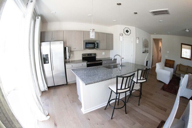 Building Photo - Introducing a one-year-old end unit townhome