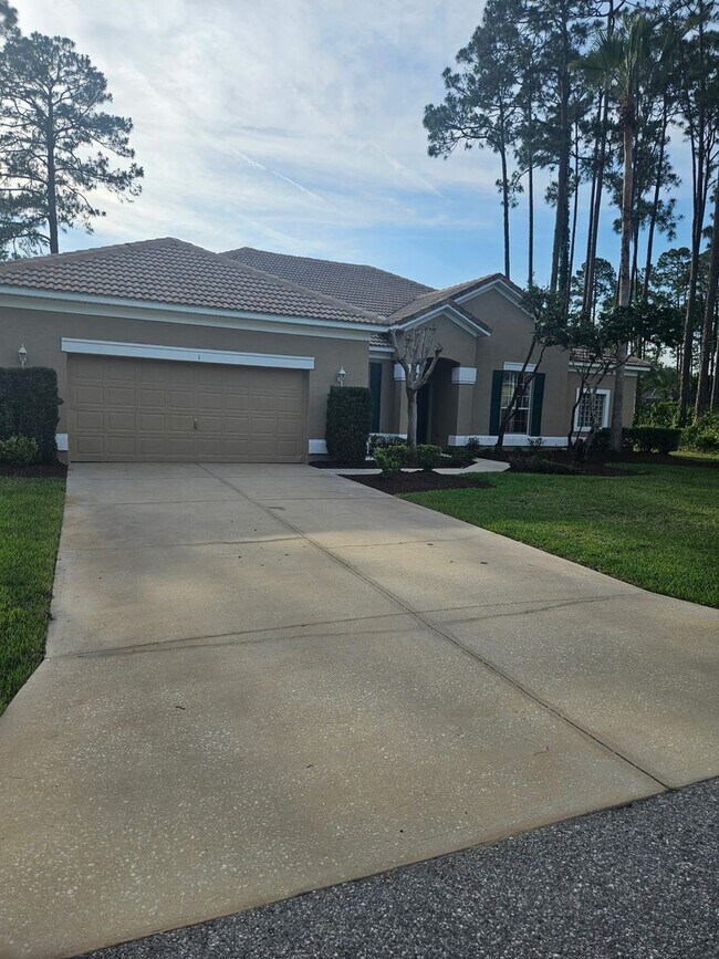 Building Photo - 4 BEDROOM 3 FULL BATH HOME WITH A SCREENED IN POOL IN THE BEAUTIFUL PALM COAST