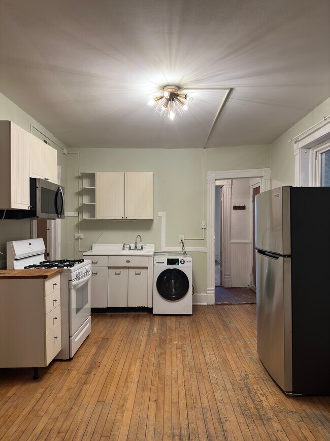 post reno photo of kitchen - 2640 West Thomas Street Apartments
