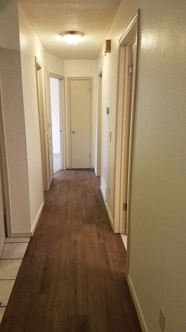 Hallway with new tile plank - 406 Gayclifee Terrace