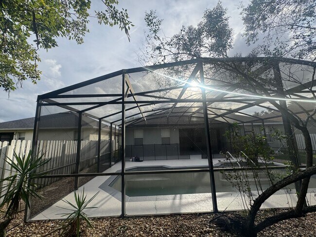 Building Photo - Modern Comfort Meets Orlando Living | Spacious 4-Bedroom Home with Large Yard! POOL HOME! GATED C...
