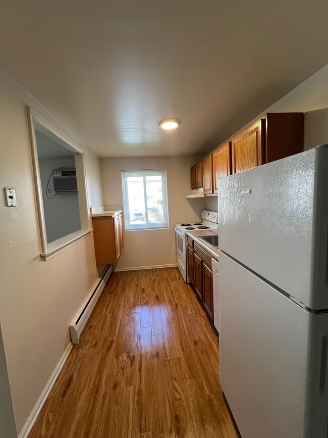 Kitchen long view - Arrowhead Court Apartments