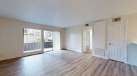 Located at 1455 San Gabriel Blvd in Rosemead, CA, this well-appointed 2-bedroom, 2-bathroom unit offers a clean, modern aesthetic across a single floor of comfortable living space. Light wood-style flooring flows consistently throughout, creating a bright and cohesive atmosphere from room to room.

The open living room is generously sized, featuring a ceiling fan and a window that allows natural light to filter in. It connects seamlessly to the kitchen area, which is outfitted with warm-toned cabinetry, a peninsula with a white countertop, stainless steel appliances including a gas range, microwave, dishwasher, and refrigerator, making it both functional and visually appealing.

The primary bedroom offers a comfortable amount of space, complete with a mirrored sliding closet and a window with vertical blinds providing outdoor views of greenery. The second bedroom is equally well-lit, also featuring a window with outdoor views and clean white walls.

Both bathrooms are finished with light wood-style flooring and modern fixtures. The full bathroom includes a tub-shower combination, a white vanity with stone-style countertop, and ample storage. The second bathroom features a single vanity with a framed mirror and stone-style countertop.

Overall, the unit presents a clean, move-in-ready environment with consistent finishes and a bright, neutral palette throughout.