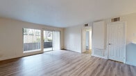 Located at 1455 San Gabriel Blvd in Rosemead, CA, this well-appointed 2-bedroom, 2-bathroom unit offers a clean, modern aesthetic across a single floor of comfortable living space. Light wood-style flooring flows consistently throughout, creating a bright and cohesive atmosphere from room to room.

The open living room is generously sized, featuring a ceiling fan and a window that allows natural light to filter in. It connects seamlessly to the kitchen area, which is outfitted with warm-toned cabinetry, a peninsula with a white countertop, stainless steel appliances including a gas range, microwave, dishwasher, and refrigerator, making it both functional and visually appealing.

The primary bedroom offers a comfortable amount of space, complete with a mirrored sliding closet and a window with vertical blinds providing outdoor views of greenery. The second bedroom is equally well-lit, also featuring a window with outdoor views and clean white walls.

Both bathrooms are finished with light wood-style flooring and modern fixtures. The full bathroom includes a tub-shower combination, a white vanity with stone-style countertop, and ample storage. The second bathroom features a single vanity with a framed mirror and stone-style countertop.

Overall, the unit presents a clean, move-in-ready environment with consistent finishes and a bright, neutral palette throughout.