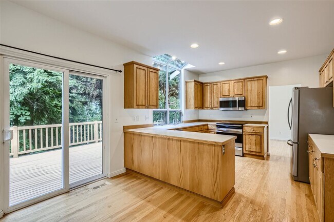 Foto del edificio - Spacious 4-Bedroom Home in Kenmore | Private Greenbelt Setting + Landscaping Included