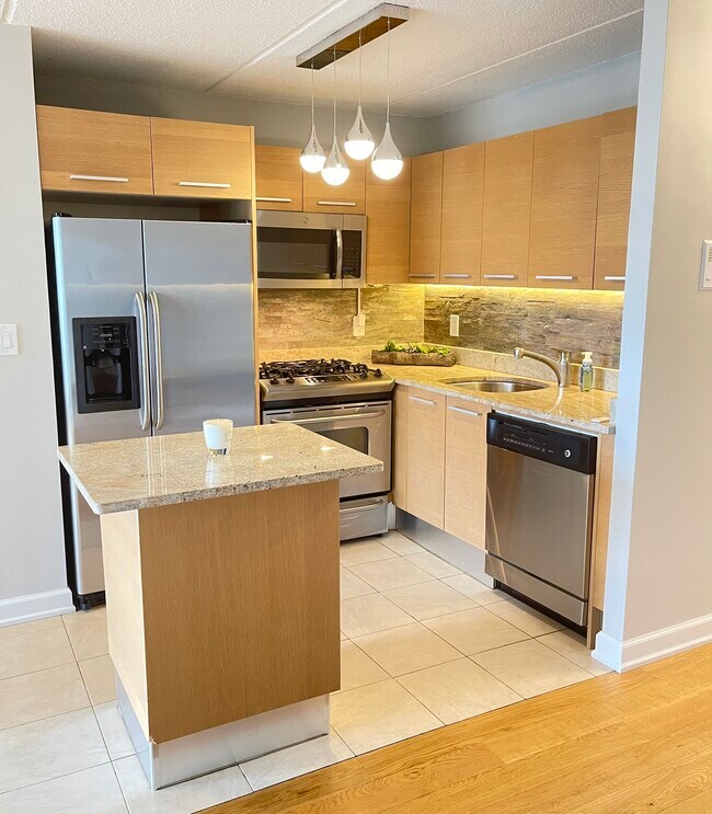 Updated kitchen with stainless steel appliances. - 1155 Warburton Ave