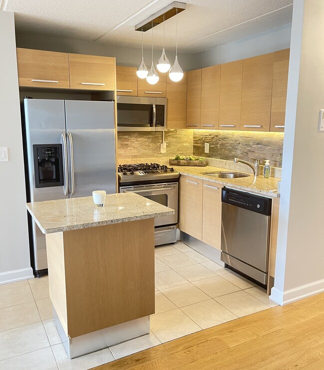 Updated kitchen with stainless steel appliances. - 1155 Warburton Ave