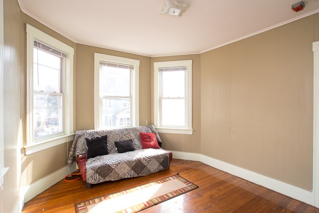 bright living room with high ceilings - 109-111 Pocasset Ave