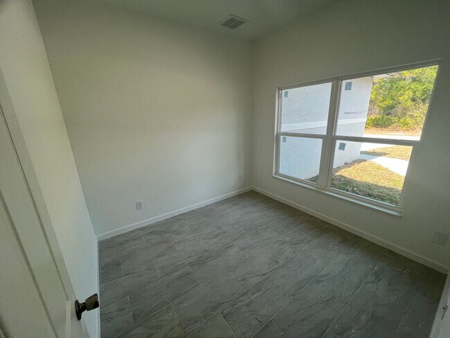 Building Photo - MODERN BRAND NEW RETREAT IN LEHIGH ACRES!