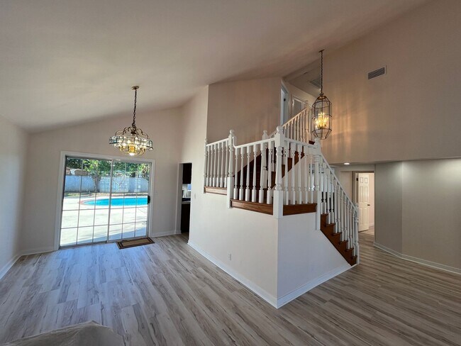Building Photo - Reseda 4+3 w/fireplace, vaulted ceilings, new flooring, solar panels, + pool! (7522 Balcom Ave)