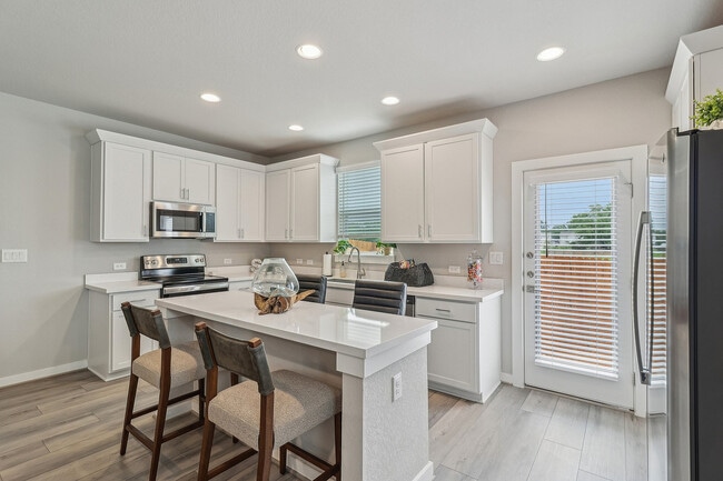 Spacious Kitchen with Island and Stainless Steel Appliances - Solstice Springs
