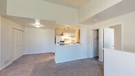 Located at 1268 W Clark Rd in DeWitt, MI, this single-floor, 3-bedroom, 2-bathroom home offers a well-designed layout that maximizes functionality. The open-concept living area features vaulted ceilings that lend a sense of spaciousness, with soft carpeting throughout and a neutral color palette that creates a bright, welcoming ambiance. The kitchen is thoughtfully positioned with a peninsula counter that opens to the living space, white cabinetry, a gas range, and wood-look flooring that adds warmth and contrast. Both bathrooms are clean and functional, each featuring a vanity with storage, a mirror, and a shower-tub combination. The primary bedroom includes a walk-in closet with built-in shelving and direct access to one of the bathrooms. The two additional bedrooms are carpeted, offer natural light through windows with outdoor views, and provide comfortable, versatile spaces. Throughout the home, consistent finishes, ample closet storage, and a cohesive design make this a practical and comfortable residence in the DeWitt community.