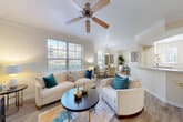 Located at 3378 Greenbriar Pkwy SW in Atlanta, GA, this well-appointed one-bedroom, one-bathroom residence offers a thoughtfully designed single-level layout. The open-concept living area is bright and welcoming, featuring light hardwood-style flooring, crown molding, a ceiling fan, and multiple windows that fill the space with natural light and views of the surrounding greenery. The living room flows seamlessly into a dedicated dining area, creating an ideal space for both relaxing and entertaining.

The kitchen is equipped with rich warm wood cabinetry, light countertops, a tile backsplash, and black appliances including a range, microwave, and refrigerator. A pass-through counter with decorative shelving connects the kitchen to the hallway, adding both function and charm.

A versatile nook off the main living area serves as a dedicated workspace, featuring a window with natural light — ideal for a home office setup. The spacious bedroom offers plush carpeting, a generous window, and direct access to a walk-in closet with built-in wire shelving. The bathroom includes a vanity with wood cabinetry, a tub-shower combination with decorative tile accents, and light vinyl flooring. This residence offers a comfortable and functional layout throughout.