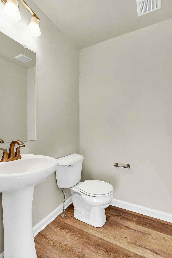 Experience tranquility in this elegantly designed bathroom, where modern elements meet comfort. - Hidden Meadows