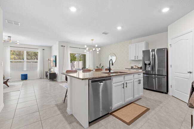 Foto del edificio - 4BR Under $2,300/mo | Tesla Charger | 15 Min to Lake Nona