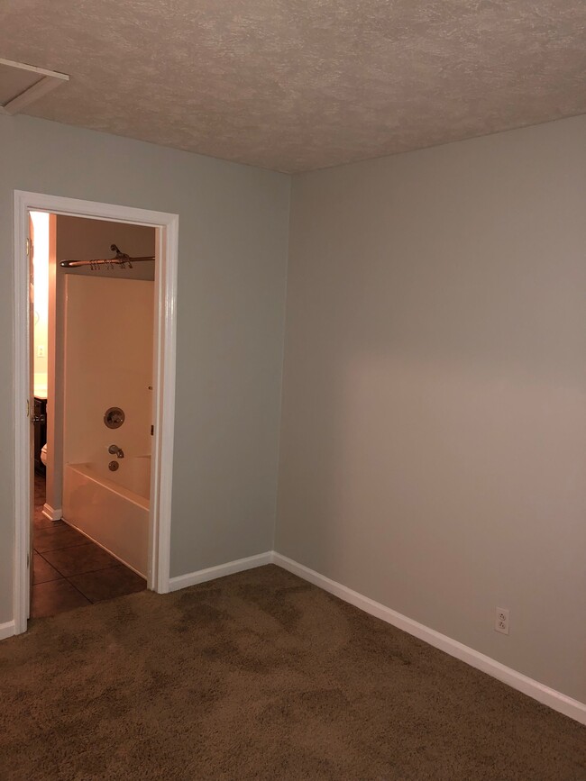 Front bedroom with door to bathroom - 639 Poplar Place