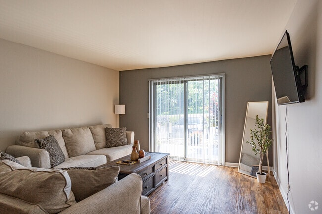 2BR 1,5 bá - 1155SF - Sala de estar - Highland Ridge Apartments