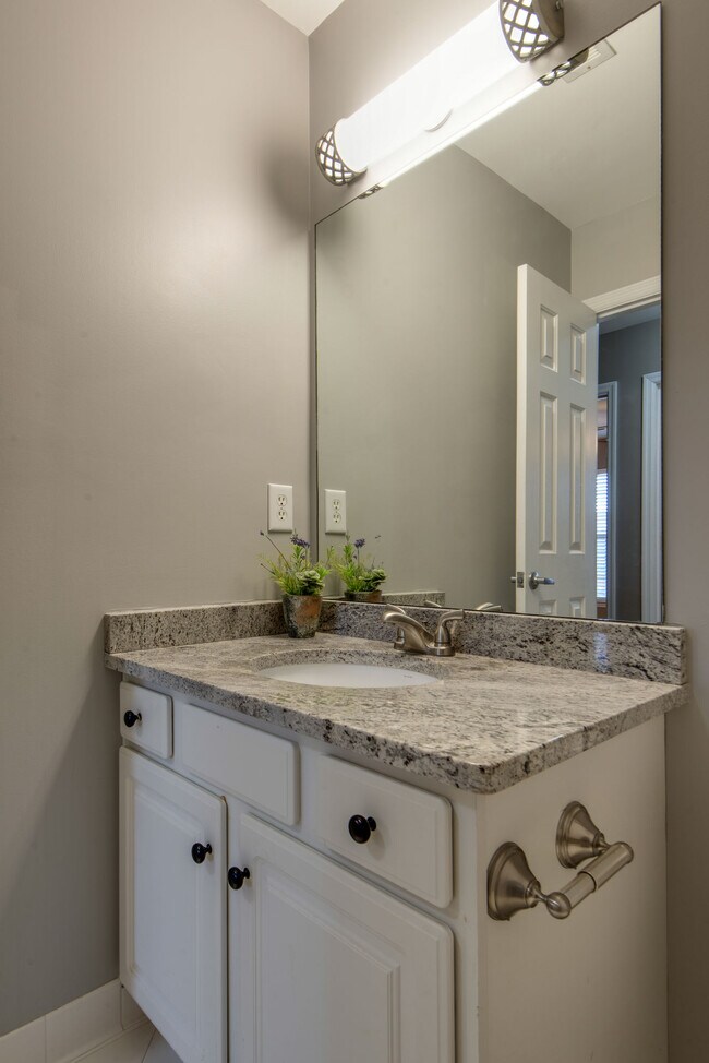 Second full bath has a tub/shower combo and is located near second and third bedrooms. - 104 Carriage Ct.