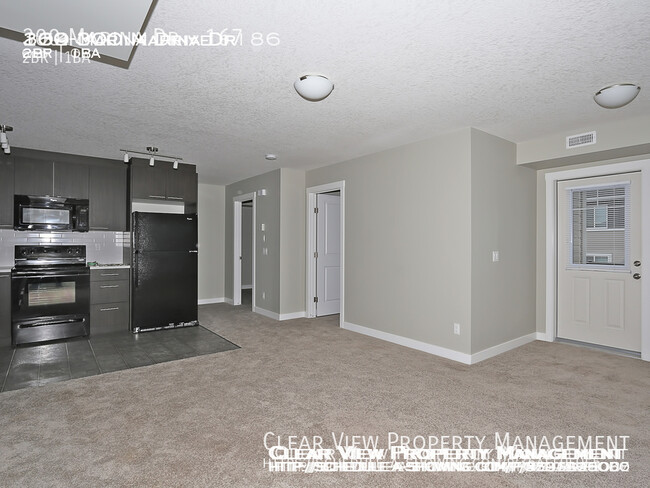 Photo du bâtiment - Chestermere Station 2 bedroom condo!