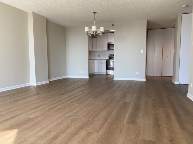 New luxury vinyl tile throughout the condo - 70 W Huron St