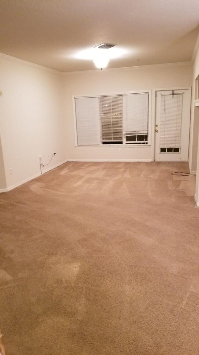 Living room with entrance to the patio - 3707 Conroy Rd