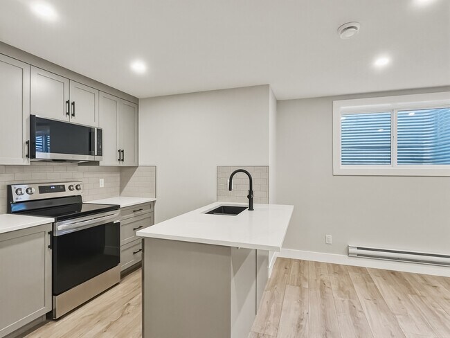 Building Photo - 2618-26128 28 Ave SW