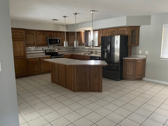 kitchen has island and newer applicances - 302 Coronation Dr