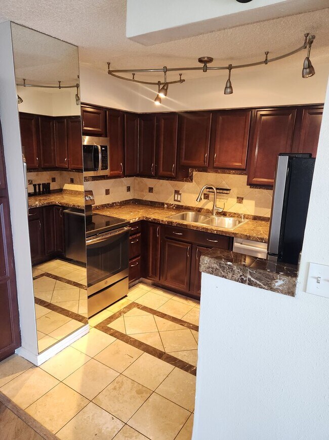 Building Photo - Affordable High Rise Condo in the heart of...