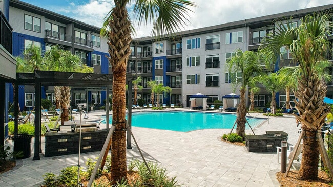 Relax in style at this luxurious apartment oasis, complete with a sparkling pool perfect for sunny days. - The Jack