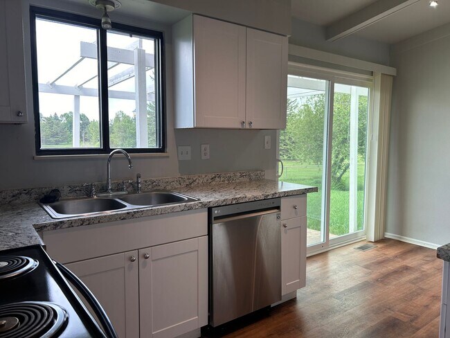 Building Photo - Spacious Fort Collins Rental with Hardwood Floors & Flex Space