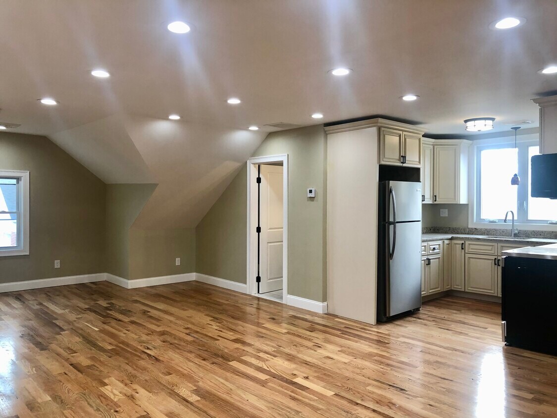 Bright, spacious, newly renovate living and dining area with recessed lighting, real hardwood floors - 83 Cottage St