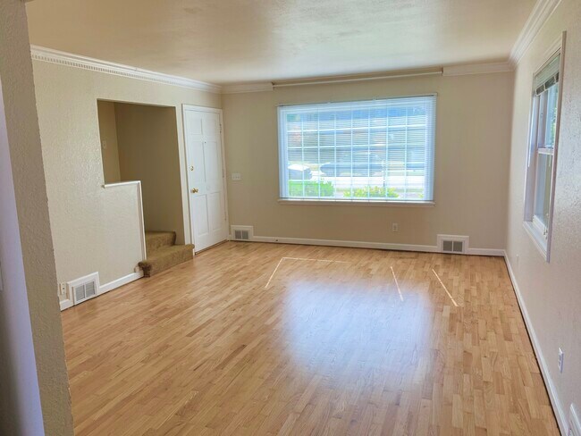 Front door/Living room with newly refinished hardwood floors - 1919 Rucker Ave