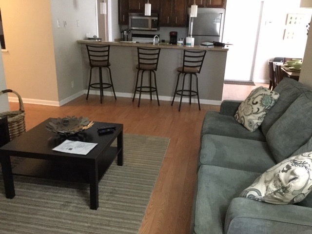 Living area open to the kitchen and dining room. - 6011 White Cloud St