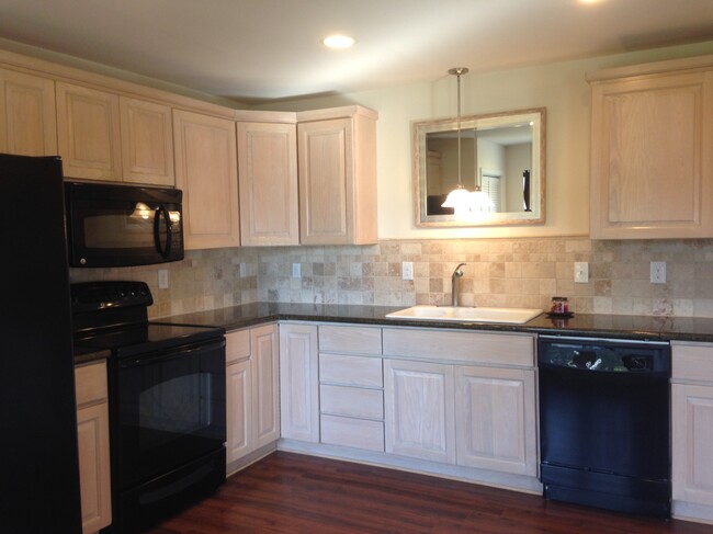 Granite countertops and marble backsplash - 6883 Marshall St