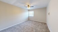 Located at 301 Woodlawn Pike in Knoxville, Tennessee, this single-floor, one-bedroom, one-bathroom residence offers a practical and comfortable layout. The open living area features neutral-toned carpet, creating a warm and inviting atmosphere throughout. Hallways connect the main spaces efficiently, contributing to a well-organized floor plan.

The kitchen is a functional highlight, showcasing warm honey-toned wood cabinetry with ample upper and lower storage, light countertops, a double stainless steel sink, and a white electric range with a ventilation hood. Wood-look flooring ties the space together cleanly and adds a touch of warmth.

The bedroom is a generously sized retreat with plush carpeting, soft neutral walls, a ceiling fan with integrated lighting, and a window that invites natural light. A large sliding-door closet provides substantial storage, keeping the room feeling spacious and uncluttered.

The bathroom features a clean, white shower/tub surround with built-in shelving, accented by teal tile details that add a subtle pop of color to the otherwise crisp, bright space.

Two hallways connect the rooms smoothly, enhancing flow and accessibility throughout this well-maintained, move-in-ready residence.