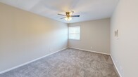 Located at 301 Woodlawn Pike in Knoxville, Tennessee, this single-floor, one-bedroom, one-bathroom unit offers a practical and comfortable layout. The space is thoughtfully arranged across a compact yet efficient floor plan, connected by two hallways that guide you through each area.

The kitchen is a functional highlight, featuring warm honey-toned wood cabinetry that extends to the upper and lower walls, providing ample storage. A double-basin stainless steel sink, light-toned countertops, and a white electric range complete the space, all set atop easy-to-maintain wood-look flooring that adds a touch of warmth.

The bedroom is a generously proportioned retreat, finished with plush wall-to-wall carpeting and neutral tones that create a calm atmosphere. A window invites natural light, while a ceiling fan with a built-in light fixture adds comfort year-round. A large sliding-door closet offers substantial storage space, keeping the room tidy and organized.

The bathroom features a clean, white tub-shower surround with built-in shelving and an accent of teal tilework, contributing a subtle pop of color. Neutral walls and clean finishes throughout give the space a move-in-ready feel. Overall, this unit delivers a well-organized, efficient living environment suited for everyday comfort.