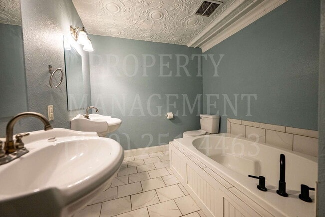 Building Photo - Beautifully Restored Downtown Caney, KS Apartment