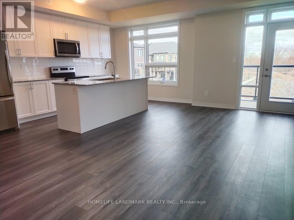 Photo principale - 103-1573 ROSE Way