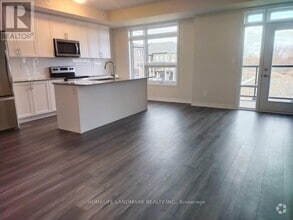 Building Photo - 103-1573 ROSE Way