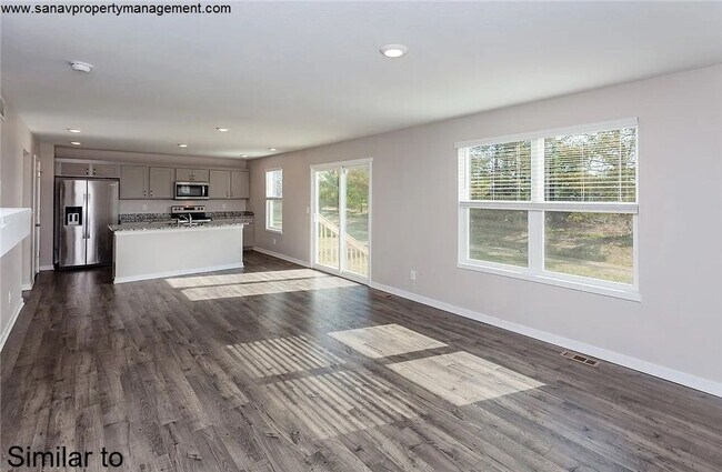 Foto del edificio - "Ankeny Oasis: Luxurious 4-Bedroom Home with Expansive 3-Car Garage and Secluded Backyard Retreat!"