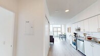 Located at 2 River Plate St in Ajax, Ontario, this well-appointed 3-bedroom, 2-bathroom unit offers a bright and contemporary living experience across a single floor. The open-concept layout seamlessly connects the living, dining, and kitchen areas, all finished with light wood-tone flooring and crisp white walls that enhance the sense of space and airiness throughout.

The living area is a standout feature, with expansive floor-to-ceiling windows that flood the room with natural light and frame impressive views of the surrounding urban skyline. The kitchen is clean and functional, equipped with white cabinetry and stainless steel appliances. A dedicated dining area sits adjacent, offering a natural flow for entertaining.

Each of the three bedrooms is thoughtfully designed with large windows that capture outdoor views, built-in sliding closets, and a calm, neutral palette. The primary bedroom enjoys a particularly striking window outlook over the cityscape.

The two bathrooms are finished in a clean, modern style, each featuring a full bathtub with shower, white tile surrounds, and contemporary fixtures. A connecting hallway with light wood flooring ties all rooms together efficiently. This unit combines functional design with modern aesthetics in a vibrant Ajax community.