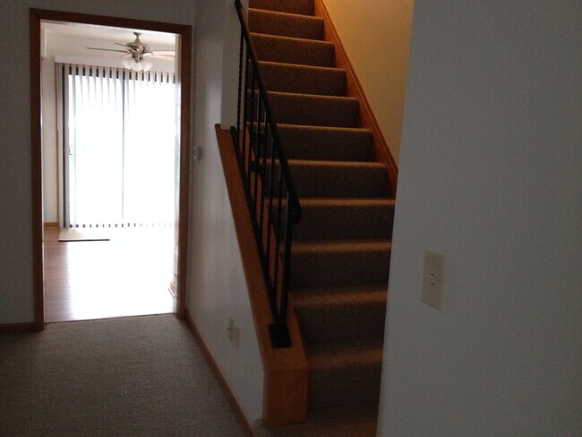 Stairs to second floor bedrooms - 3678 W Lake Rd
