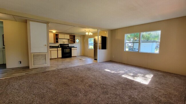 Building Photo - Freshly painted spacious 2-bedroom 1-bath home with a screened porch and storage shed.