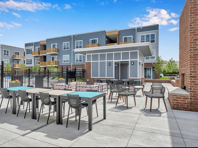 Outdoor fireplace and seating area. - Graceland Flats