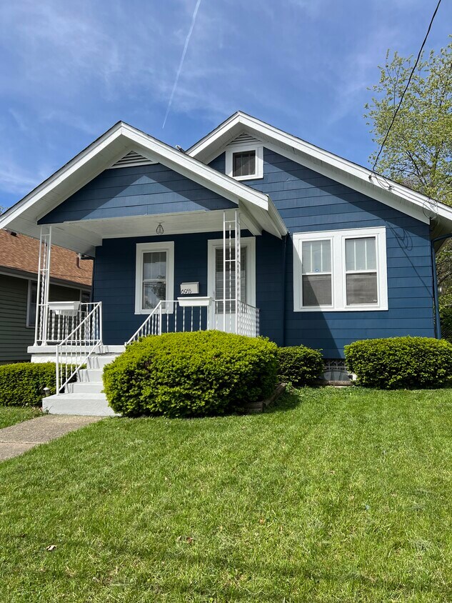 Beautiful new exterior paint and covered front porch with ample parking on side of house - 6955 La Boiteaux Ave