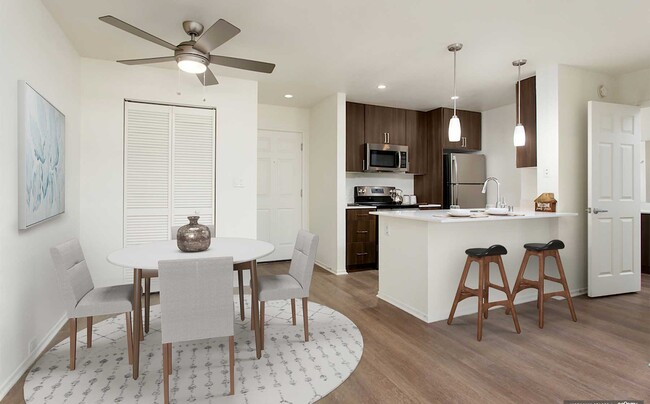 Premium Apartment Kitchen and Dining Area with Hard Surface Vinyl Plank Flooring - eaves Seal Beach