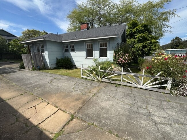 Building Photo - Sit out with your pet on the patio of this...