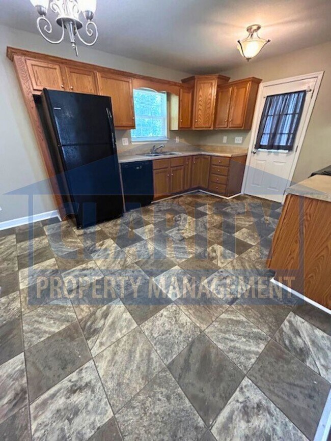 Building Photo - Charming three-bedroom home with carport!